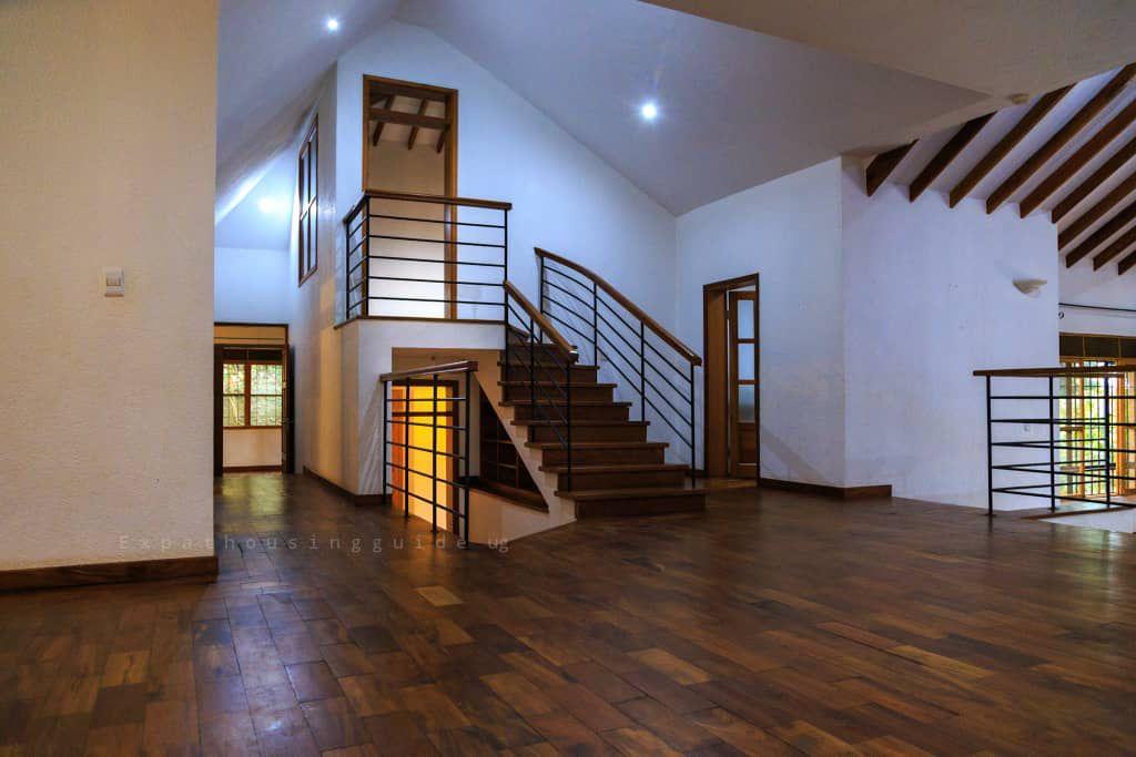 Living area with timber floor and staircase, 4-bedroom house, Mbuya